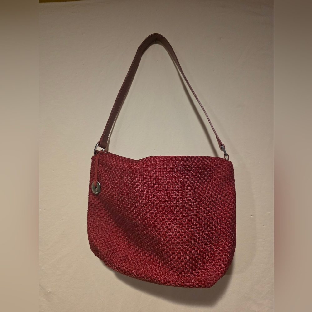 The Sak Red Woven Shoulder Bag with Silver Charm